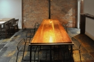 The second part of the basement is dominated by this long communal table.