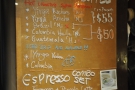 The beans/preparation methods are listed on this menu board next to the entrance.
