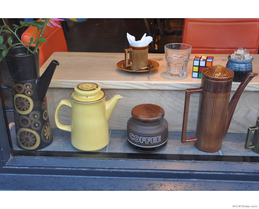 There's a display of interesting, old coffee pots in the window...