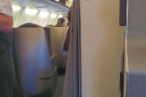 Of course, right at the front of economy means next to business class.