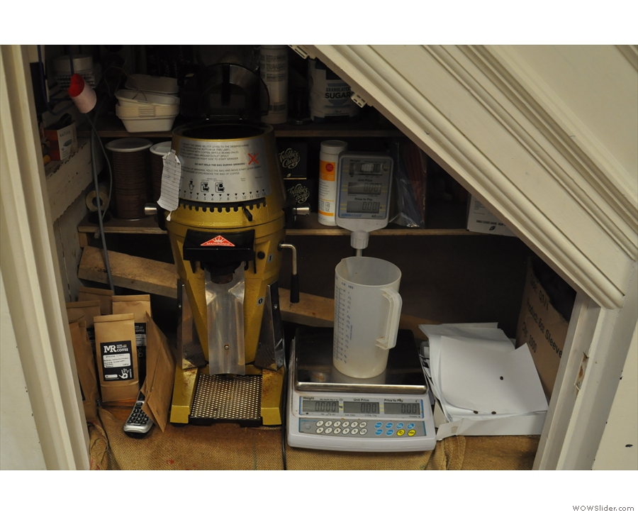 There are scales (and a grinder, if it's needed) under the stairs for retail sales.