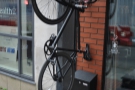 The bike, hanging from the brackets outside, is a sure sign that Dan's behind the counter.