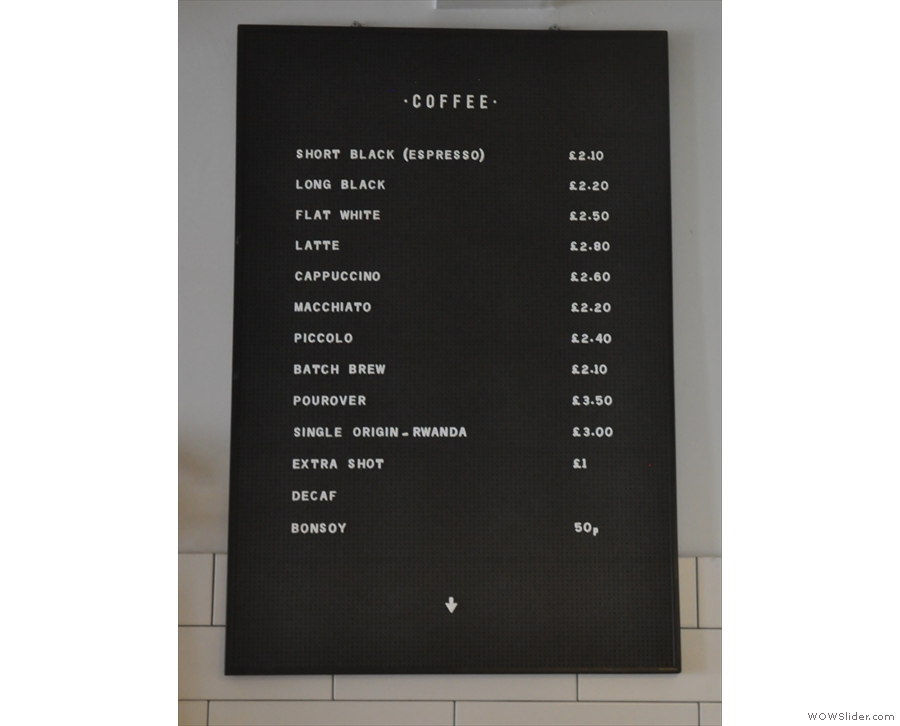 ... while the drinks menu is on the wall above the espresso machine.