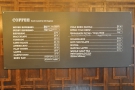 The espresso and other drinks menu is on the wall behind the counter.
