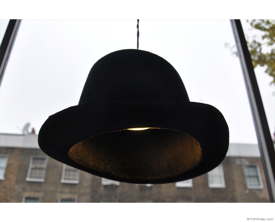 ... with lampshades made of old hats.