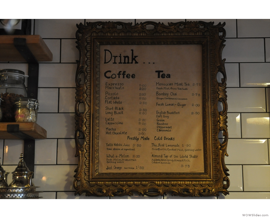 ... while you'll find the drinks menu, framed on the wall.