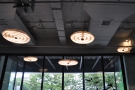 Despite bieng lined with windows, the cafe has lots of lights.