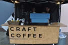 The stall's simplicity itself: counter, espresso machine & grinder, all protected by a gazebo.
