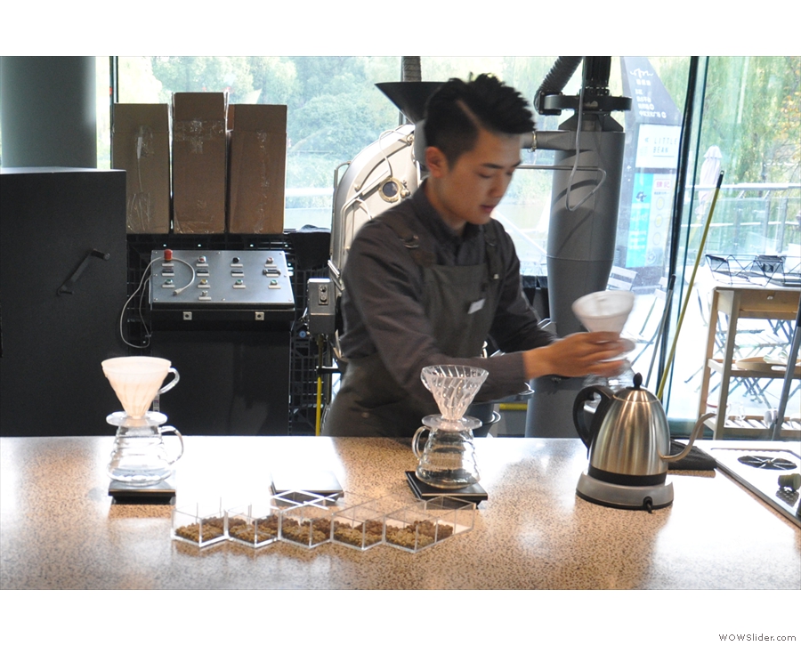 Returning the following day, I went for a pour-over. Here the barista rinses the filter papers.