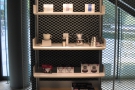 Little Bean has two sets of retail shelves. This one, with the coffee kit, is on the right...