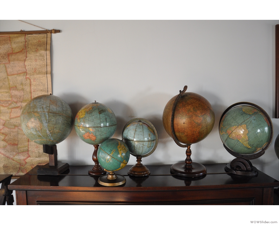 I was also taken by the collection of globes on top of the piano.