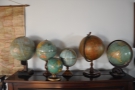 I was also taken by the collection of globes on top of the piano.