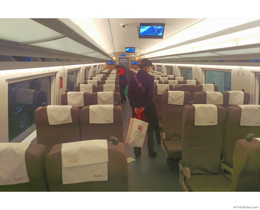 The seats in standard class, arranged in rows of 2+3. This was taken at Beijing...