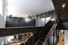 Carrying on, the stairs lead up & across to a mezzanine level above the front of The Corner.