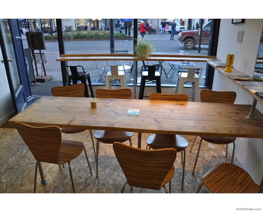 ... followed by this large, communal table which almost divides the space in two.