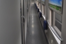 Inside, a long corridor with fold-down seats gives acess to the sleeping compartments.