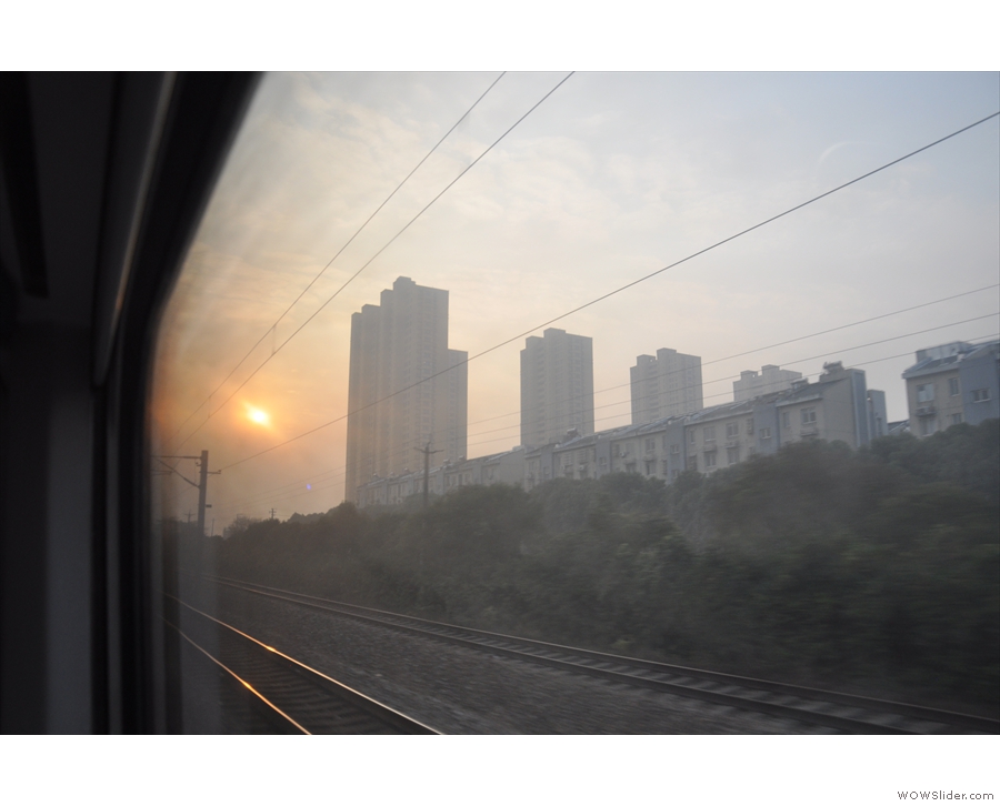Not long after dawn as the train speeds towards Shanghai.