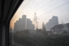 A very familiar landscape: we zoom past tower blocks lining the side of the track.