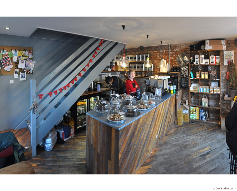 Stepping inside, you'll find a cosy downstairs dominated by the counter at the back.