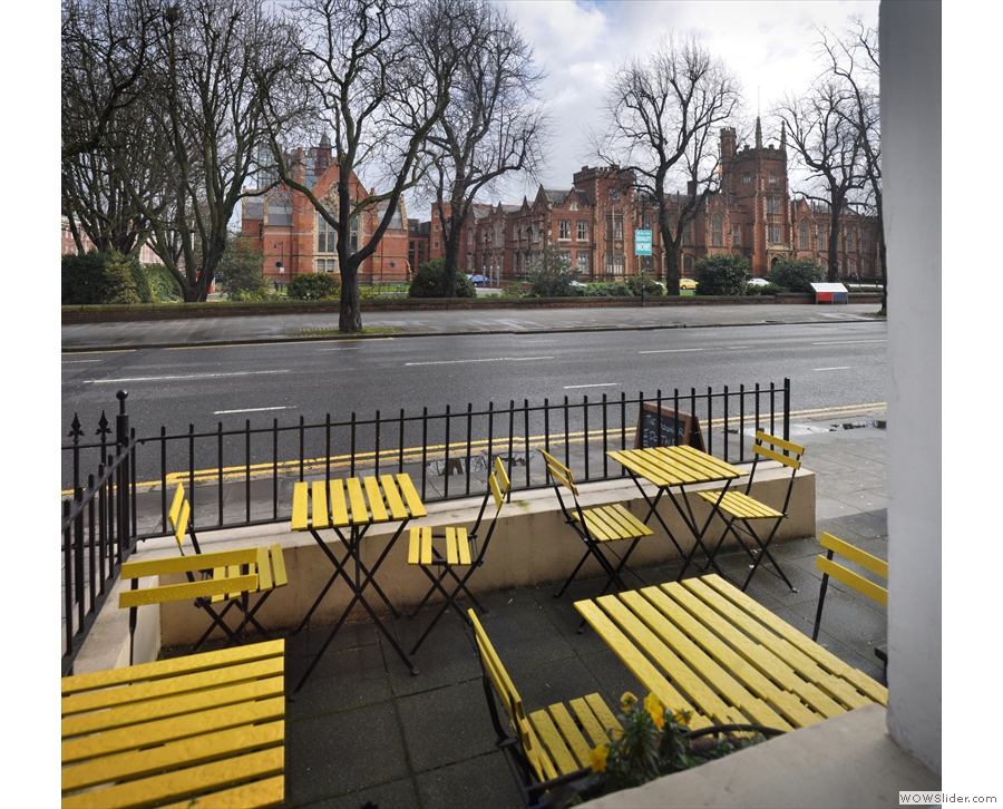 You can look out over the outdoor seating and across the road to Queen's University.
