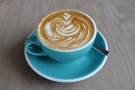 My flat white, with some excellent latte art, in a lovely blue cup.