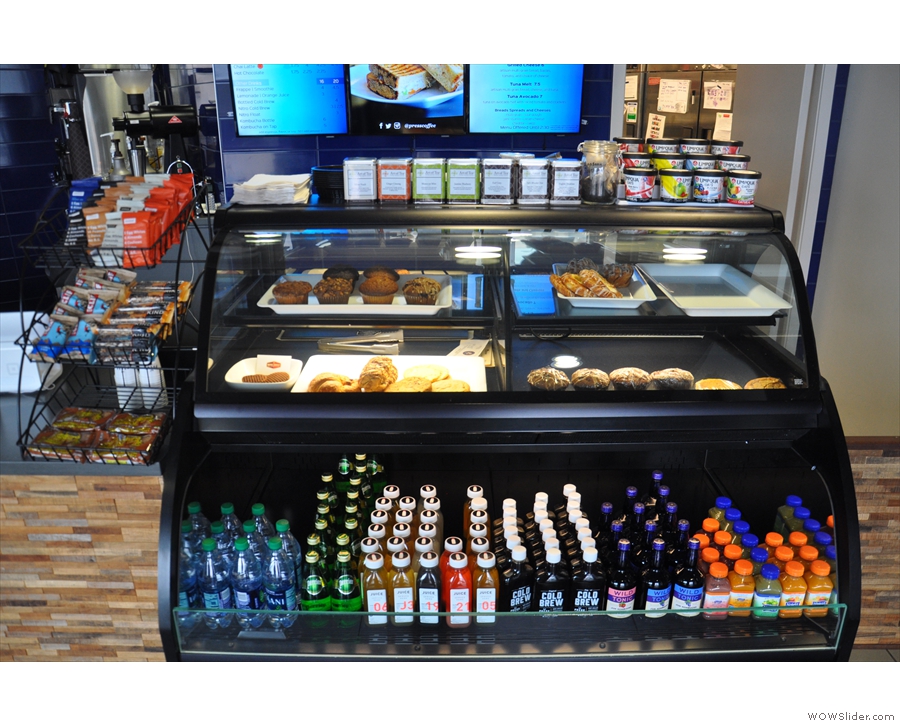 A chiller/display cabinet full of cakes and soft drinks greets you as you enter...
