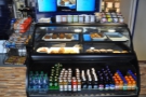 A chiller/display cabinet full of cakes and soft drinks greets you as you enter...