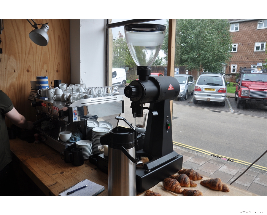 The espresso machine in the window has a Mythos 1 grinder, plus an EK-43...