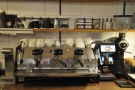 However, my eye was drawn to the three-group La Marzocco Strada behind the counter.