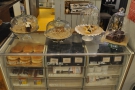 The cakes are all displayed on the right-hand side in this old glass display case...
