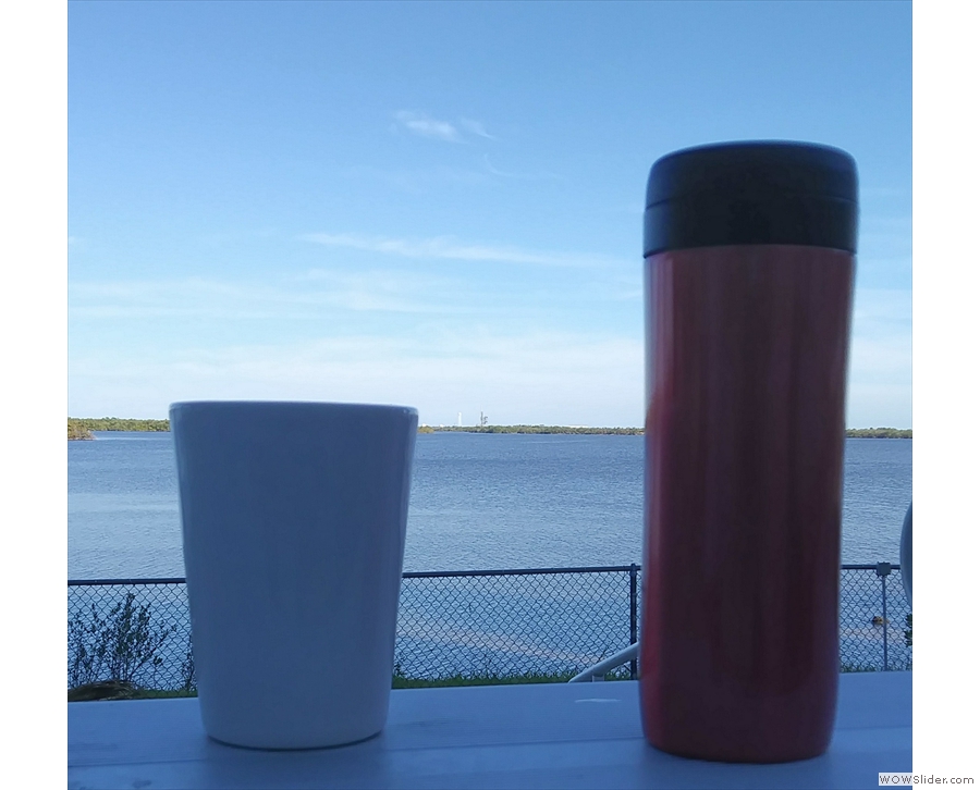 I take my coffee to all the best places: here, looking out at the Falcon Heavy rocket on the launch pad at Kennedy Space Center.