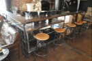 There's a row of five stools down the right-hand side of the roastery area...