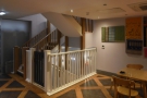The stairs deposit you in a large, basement-like space with additional seating.
