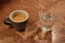 My espresso, served with a glass of sparkling water, of course.
