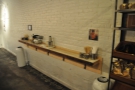 Opposite the espresso machine, another narrow bar acts as the takeaway station.