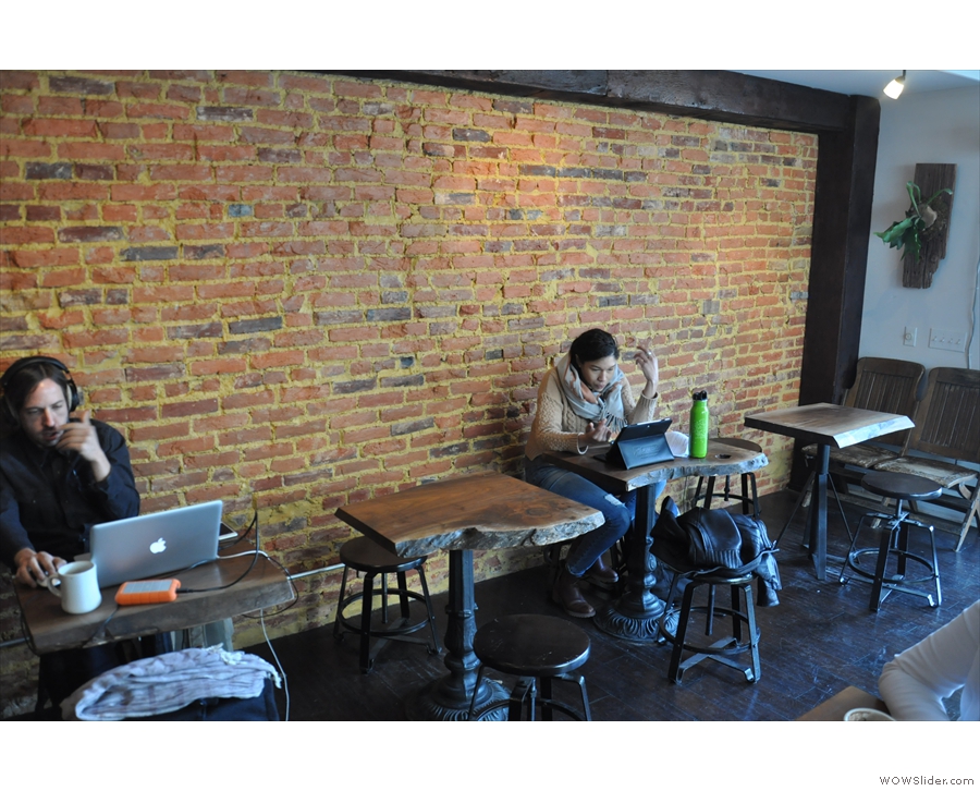 They kicked off a row of four tables along the exposed brick of the right-hand wall.