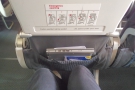 Onboard, and I'm in my exit-row seat. There is, as usual, just enough leg room...