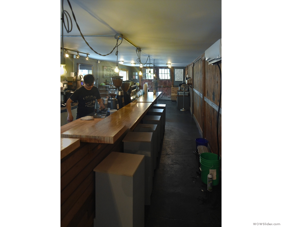 The view of the counter and the counter seating from the back.