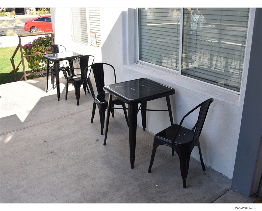 The builk of the seating is out on the patio, with a pair of tables against the east wall...