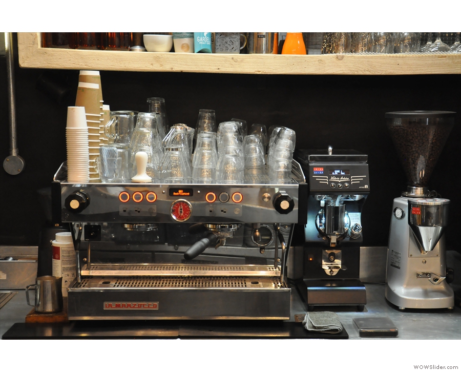 The espresso machine, a La Marzocco Linea, is at the back of the counter.