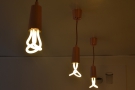 These exposed bulbs hang above the counter...