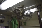 Although the carriage is air-conditioned, fans hang from the ceiling at regular intervals.