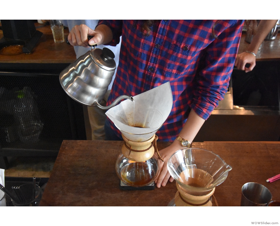 Once the coffee has bloomed, there's a series of short, controlled pours...