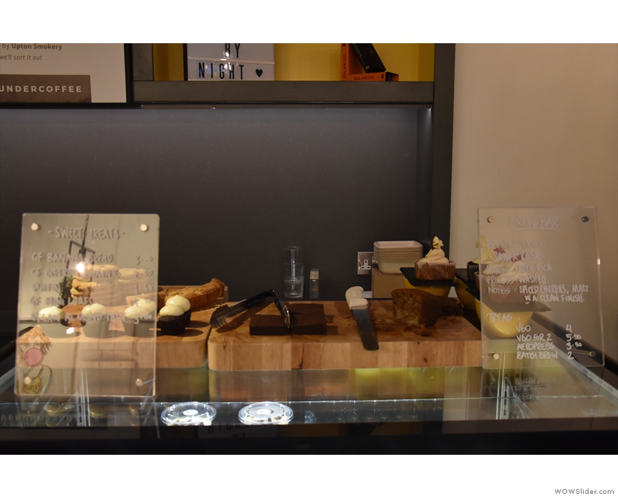Cakes are displayed off to the right.