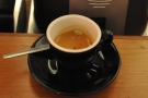 ... this lovely espresso made with the houseblend and served in a classic, black cup.