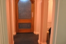 Meanwhile, this is the front door, the arches giving it the corridor-like effect we saw earlier.