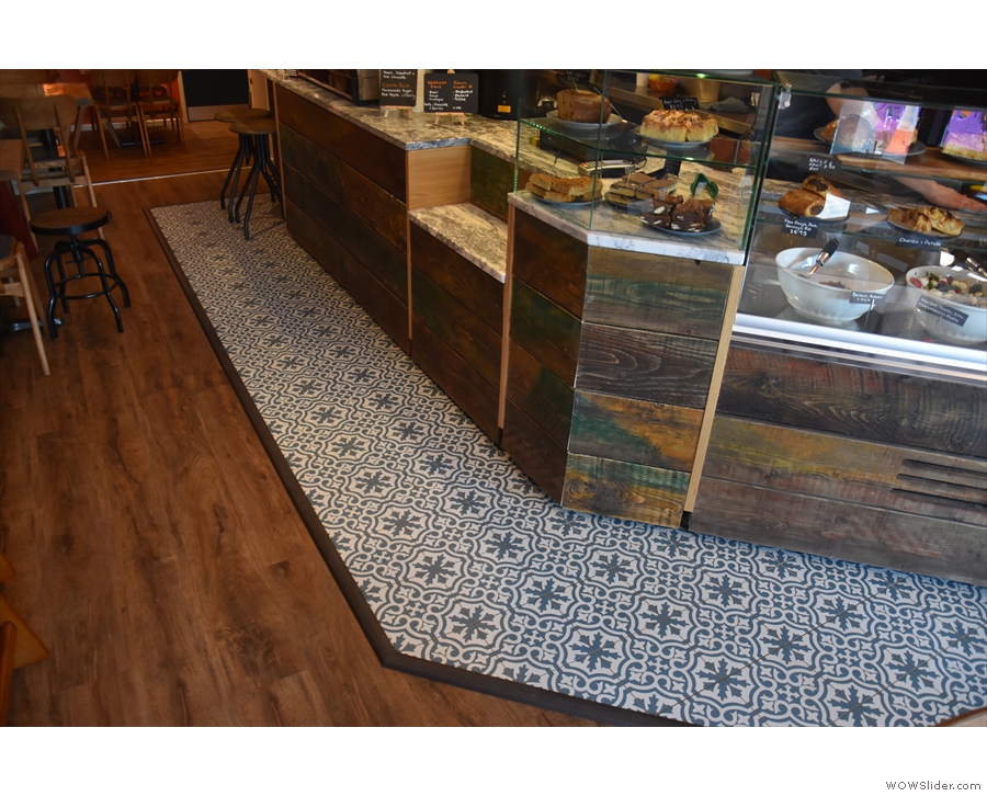 There are many neat features, including wooden floorboards throughout, plus these tiles.
