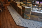There are many neat features, including wooden floorboards throughout, plus these tiles.