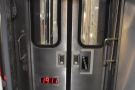 Note the doors between carriages with both push-to-open and kick-to-open buttons.