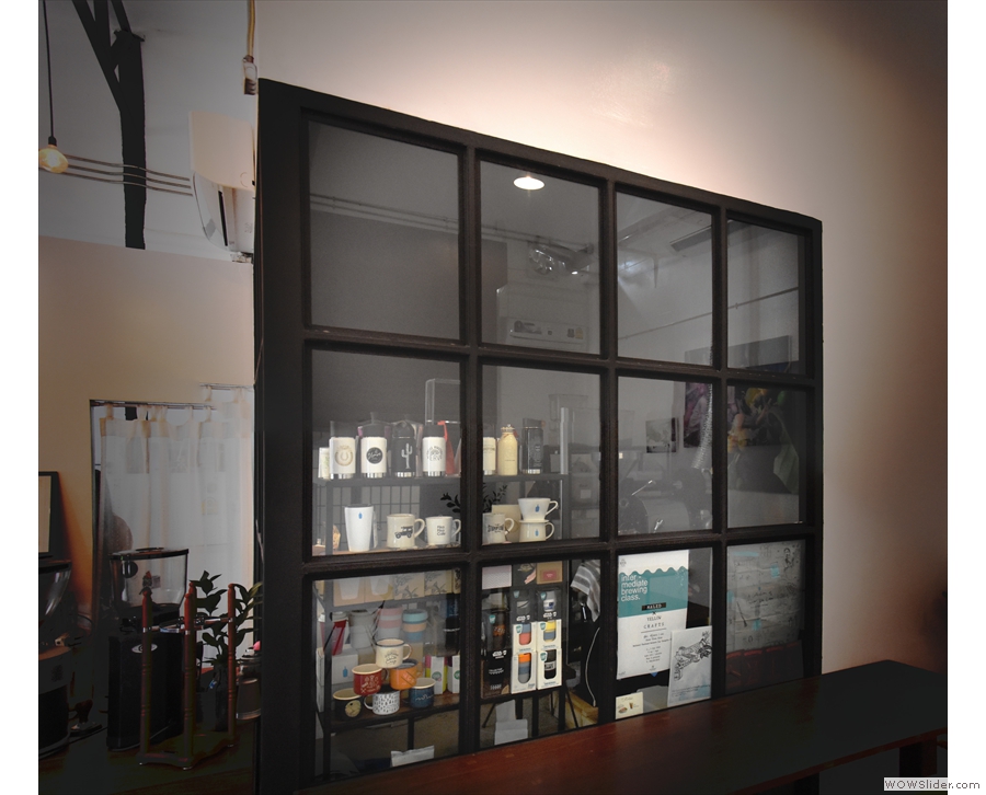 Beyond the counter is a glass-walled room...